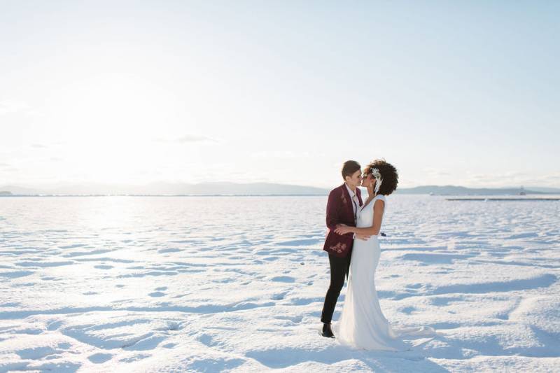 Same sex kissing on frozen Lake Champlain in the winter