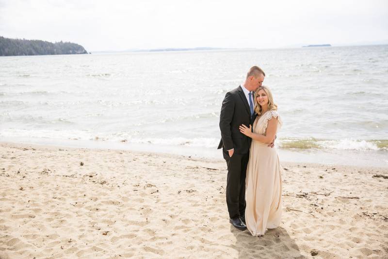 Couple posing on Leddy Beach on Lake Champlain in Burlington Vermont during spring elopement