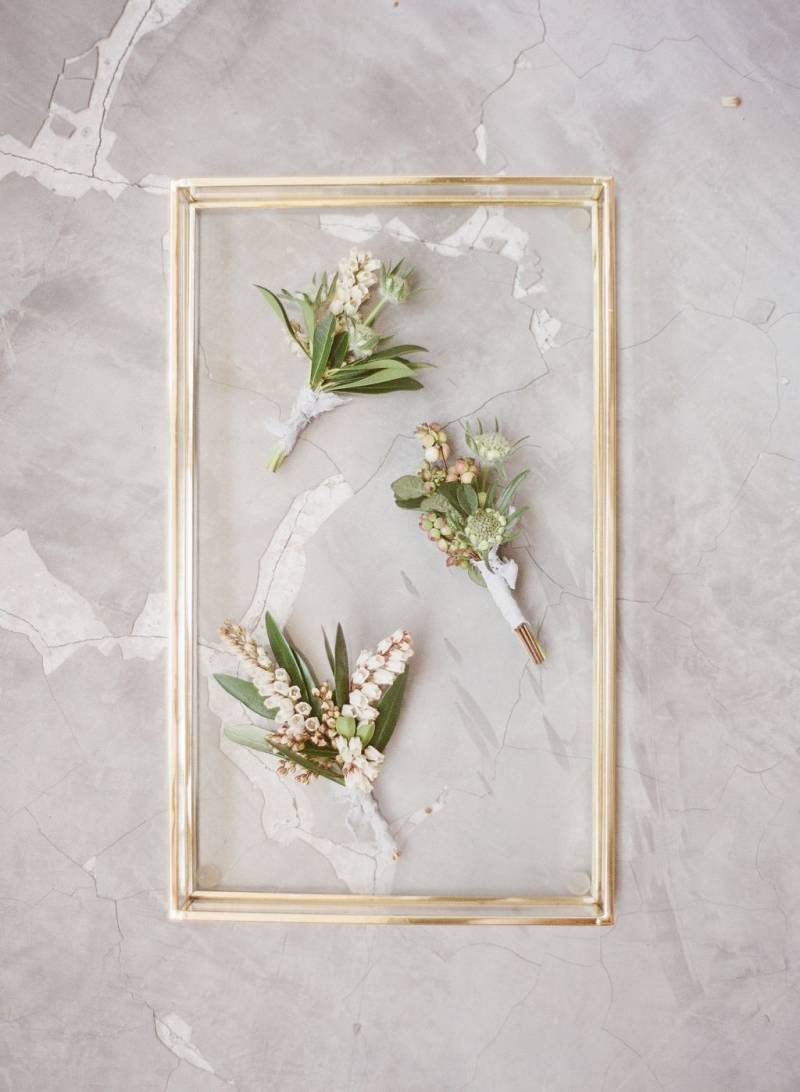 Buttonholes in gold frame
