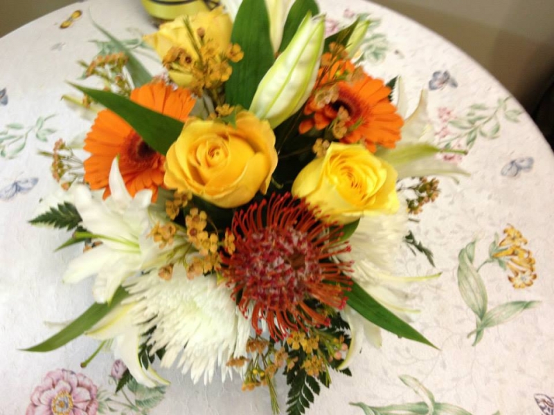 Yellow and Orange Flowers buffet Arrangements - Winnipeg Florist by In Full Bloom