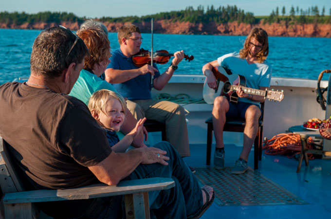 People playing music on a boat