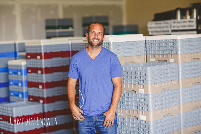 Steven showing Glassware Organized in Crates of Color Coded Cubicles - Cameron Ingalls | The Wedding