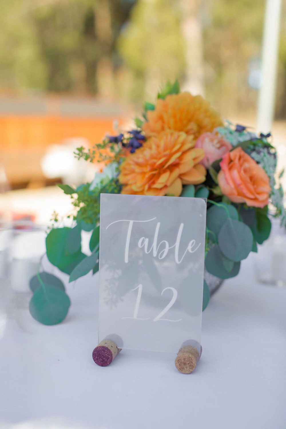 table, signage, flowers, centerpiece