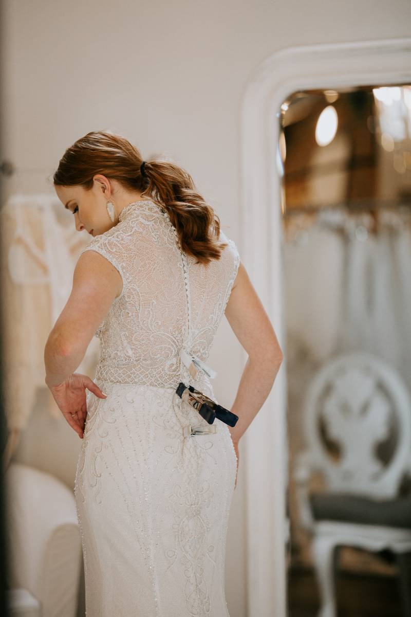 bride to be trying on wedding gowns at Emma and Grace in Denver Colorado