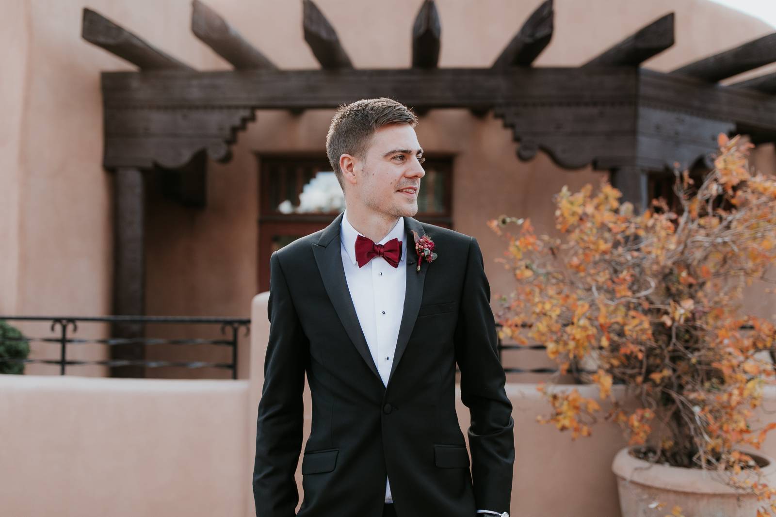 Sante Fe groom in black tux with burgundy bow tie