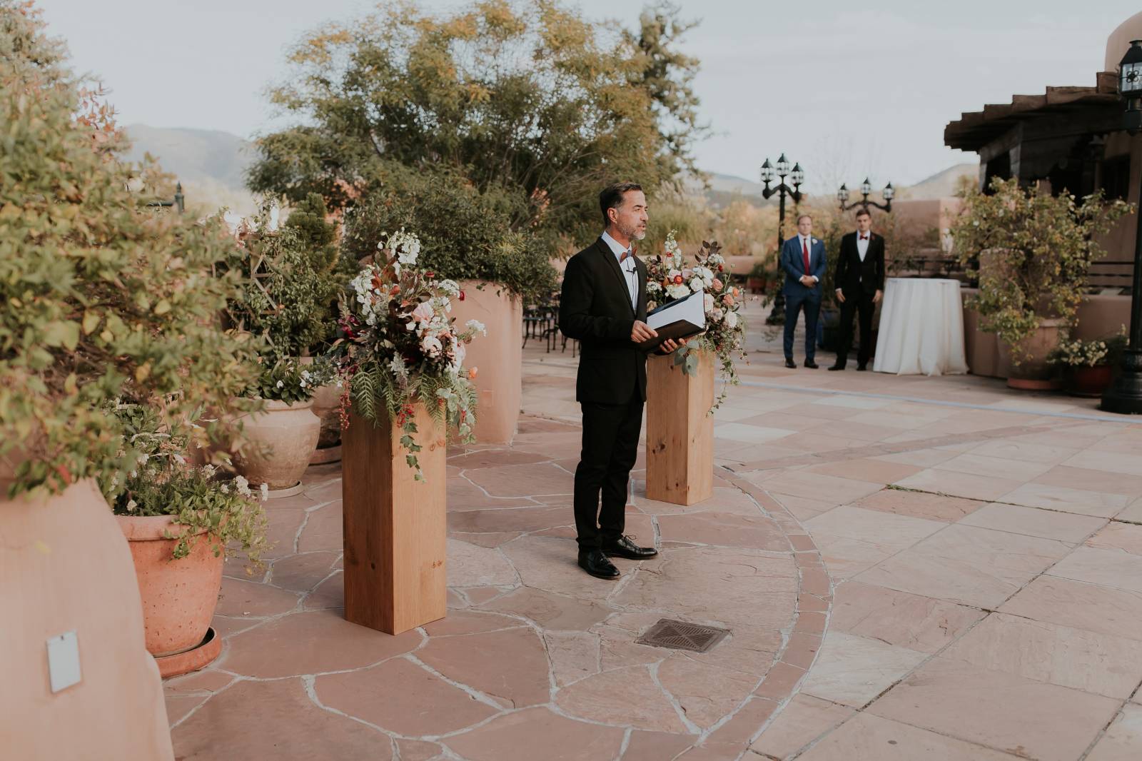 wedding officiant standing at the alter at the La Fonda on the Plaza
