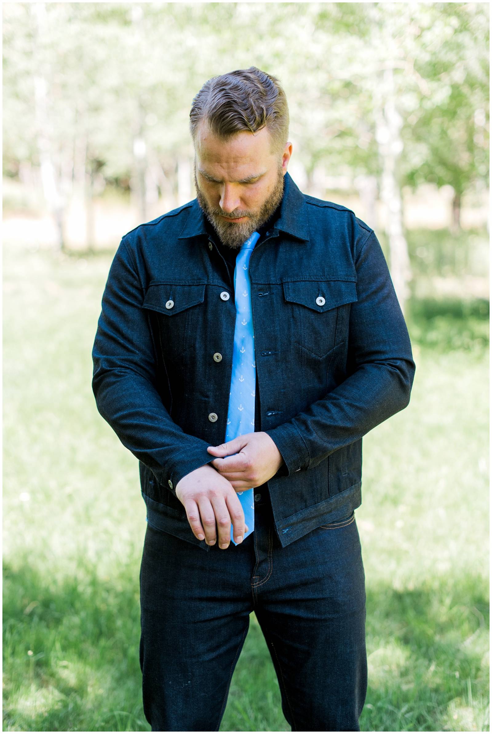 groom in denim jacket and polka dot blue tie
