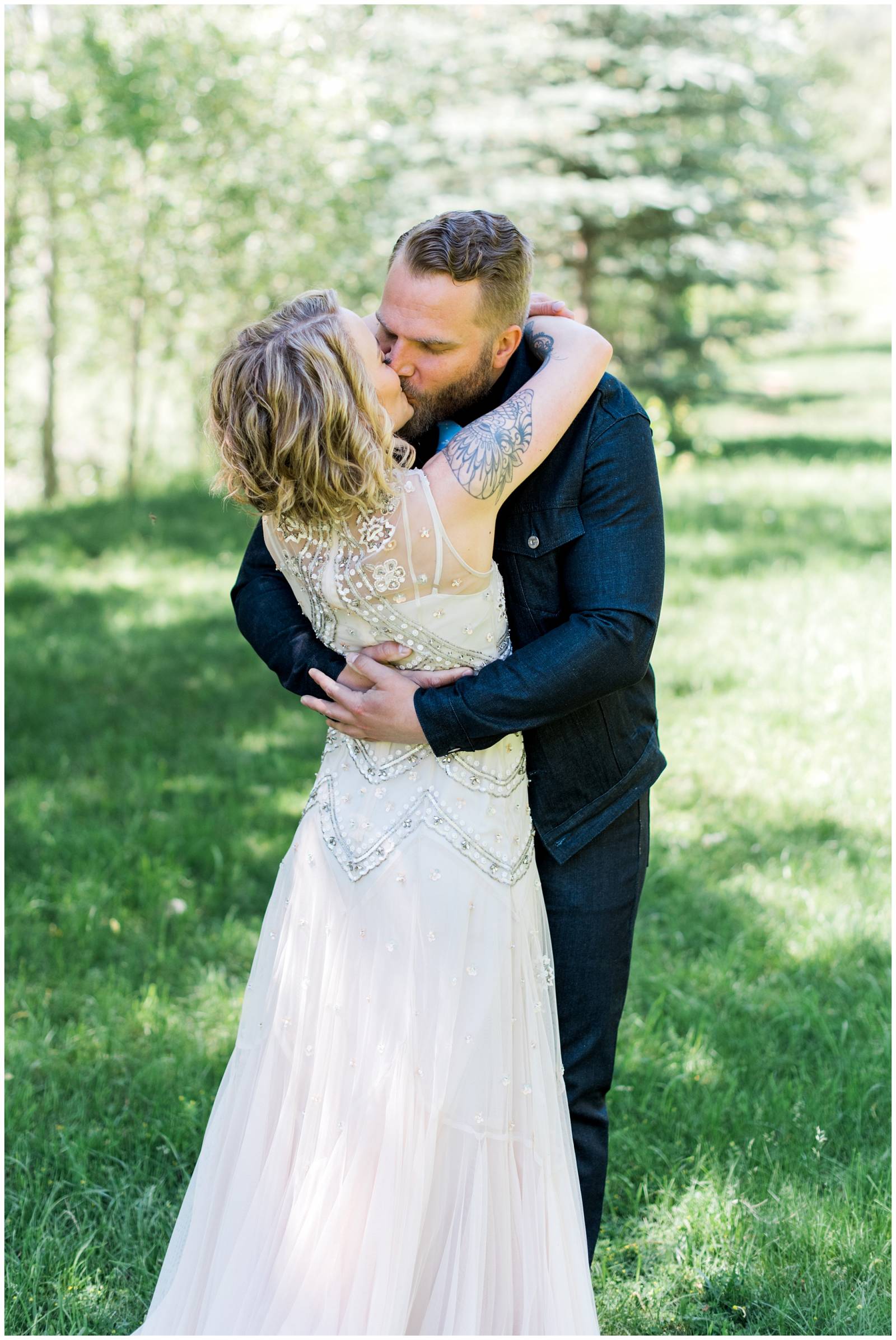 bride and groom sharing a kiss captured by Erin Elizabeth Photo