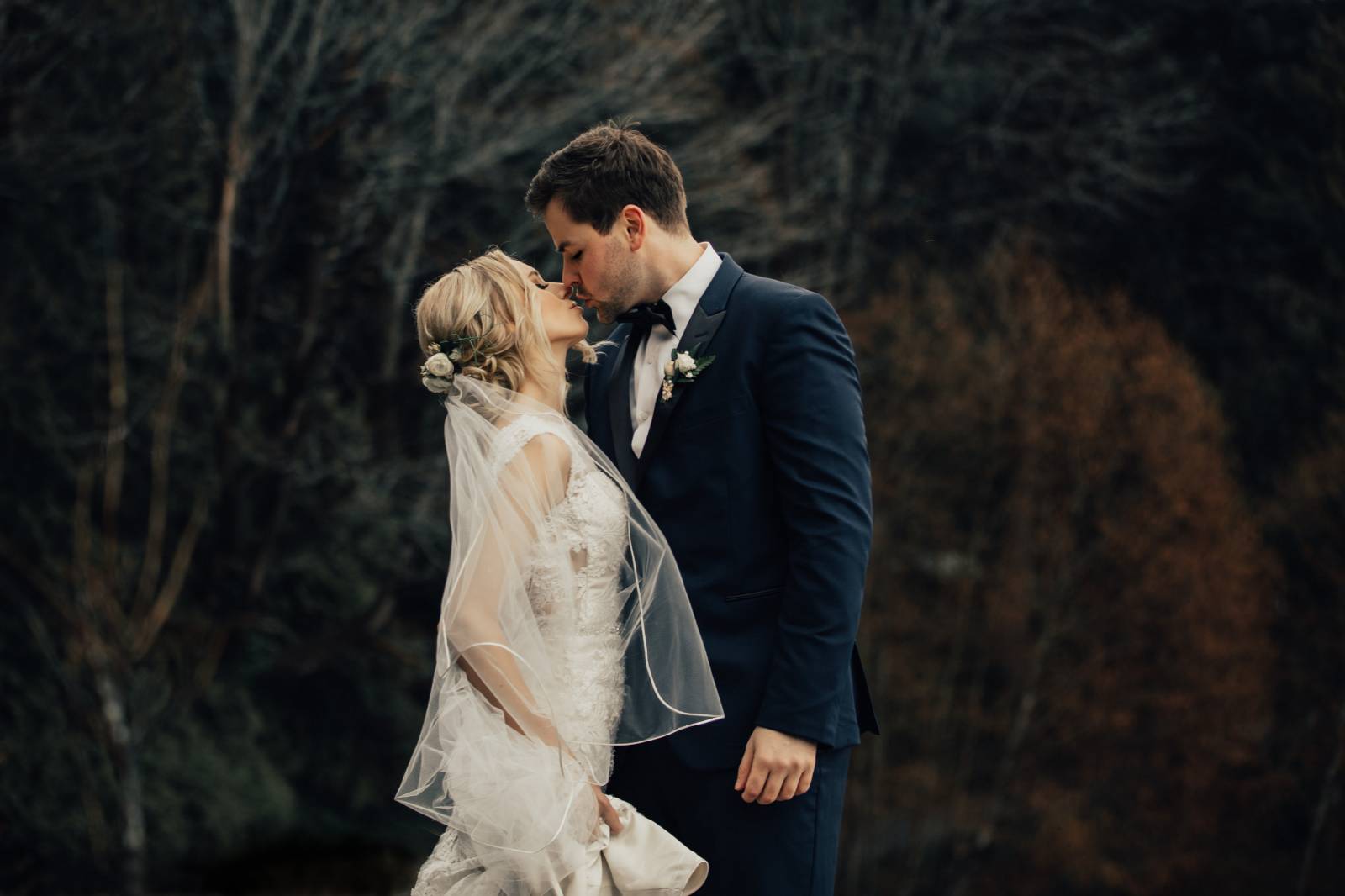 bride and groom kissing outdoors captured by Nomad by NK