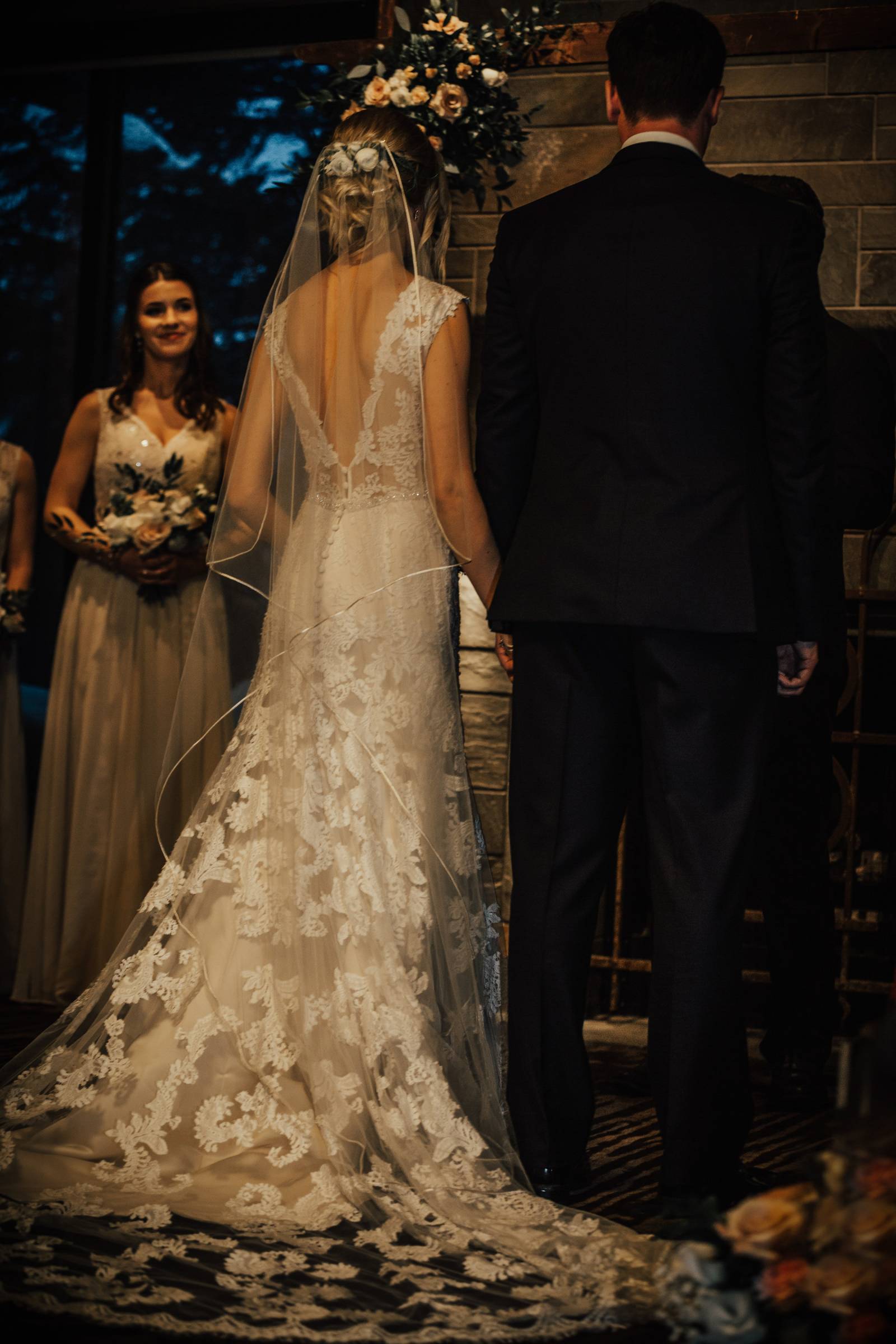 bride and groom holding hands at wedding | Grouse Mountain wedding planned by Umbrella Events
