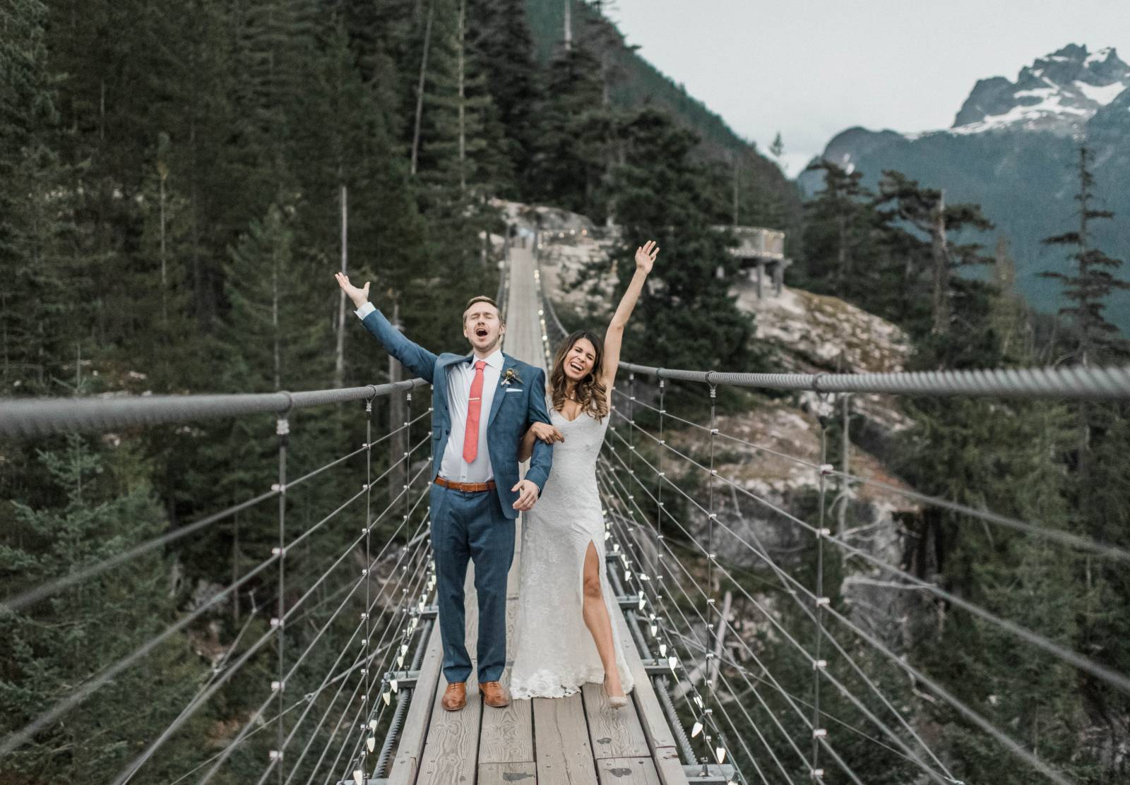 portrait of bride and groom on BC bridge