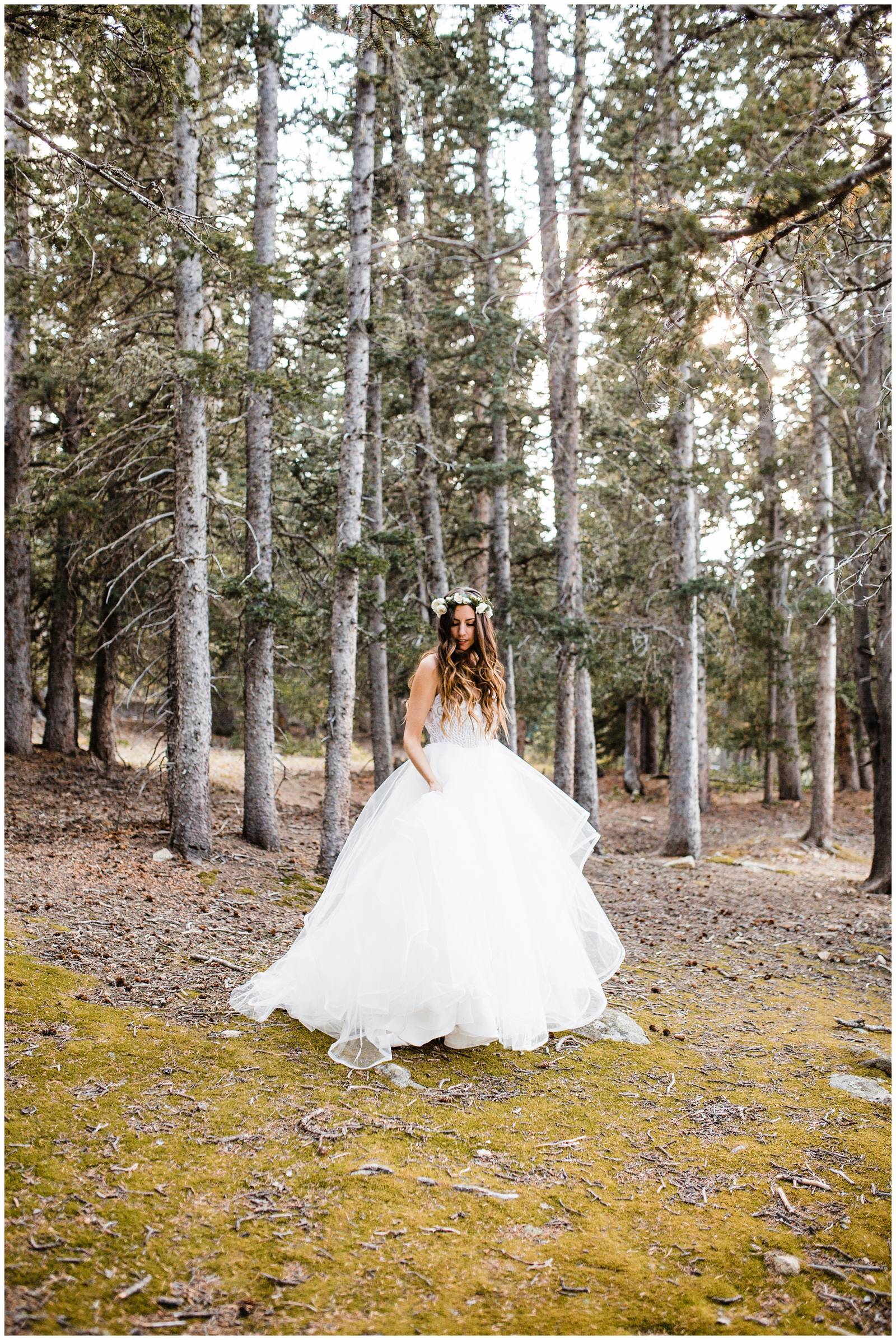 bride wearing wedding dress from a & bé bridal shop in Colorado mountains