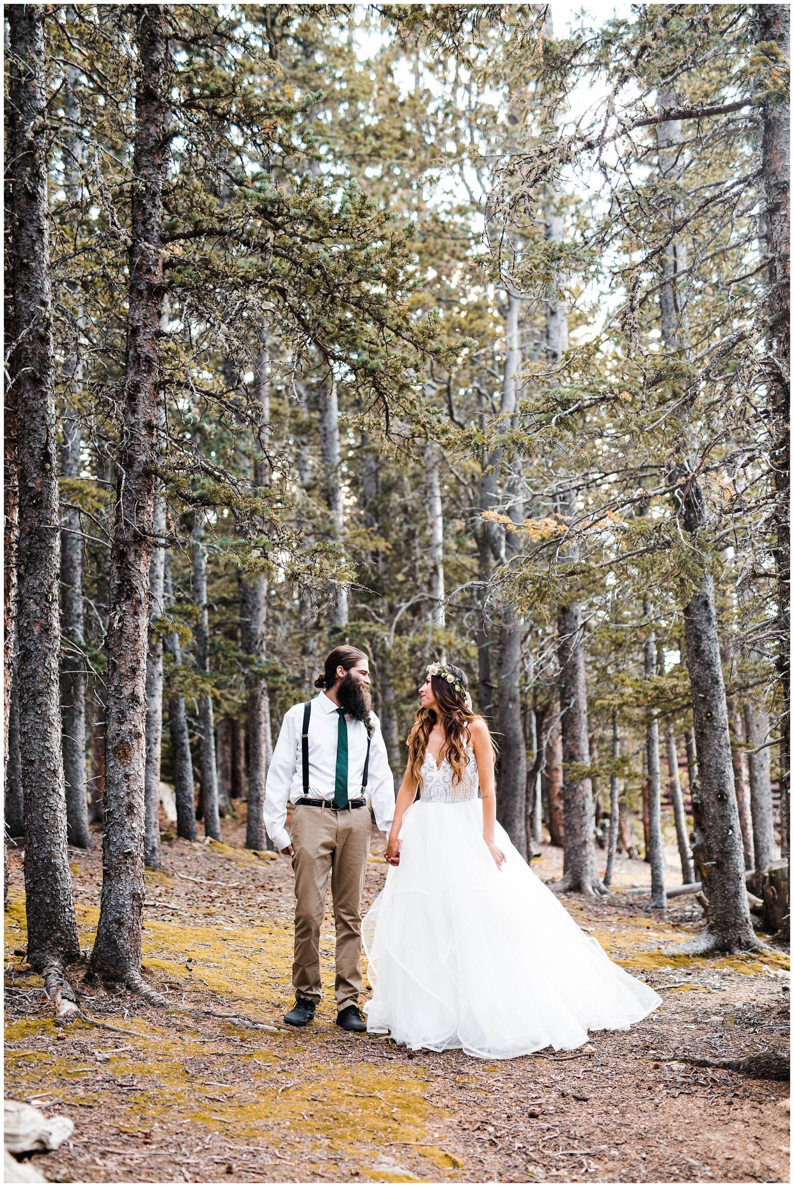 portrait of bride and groom in mountain forest in Colorado
