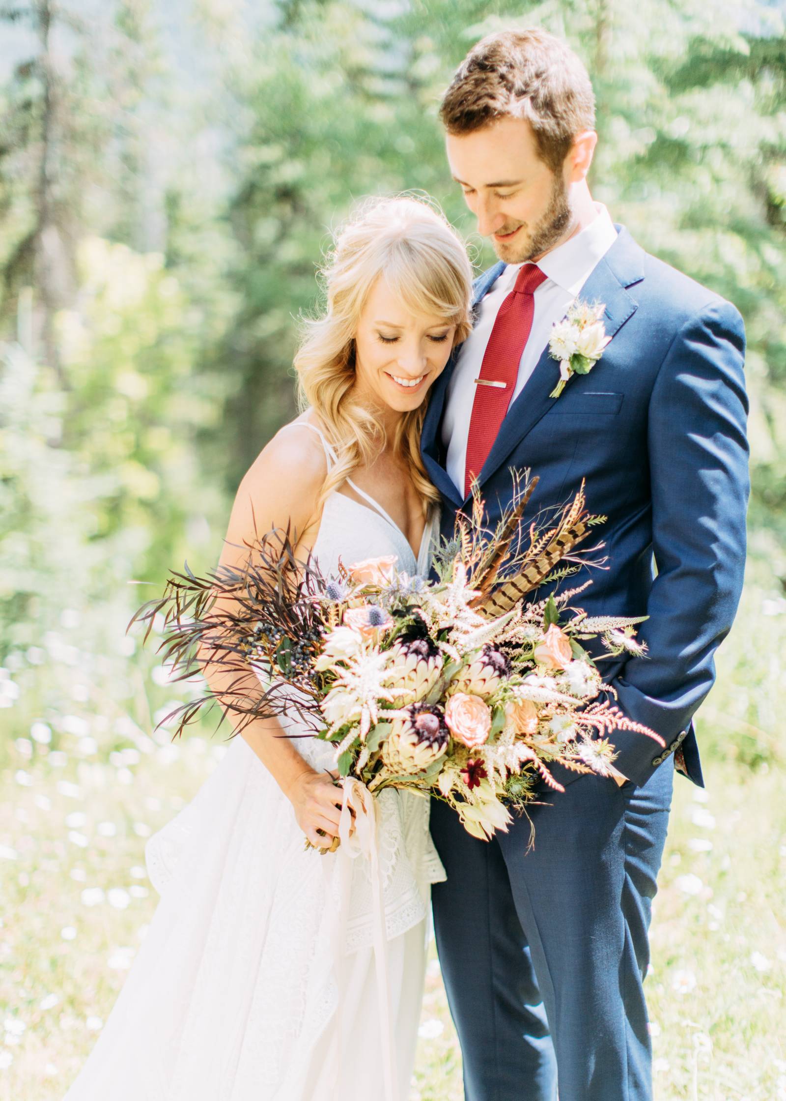 portrait of bride and groom in Banff mountains | wedding bouquet by Always Sunny