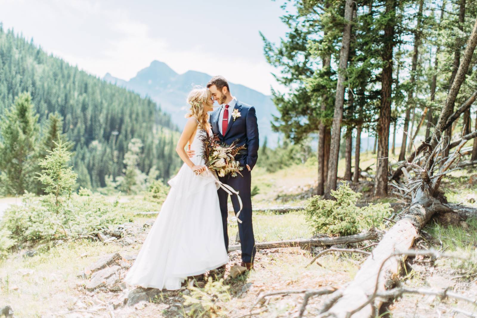 Banff wedding portrait of bride and groom in the the mountains | bride in Hayley Paige wedding gown