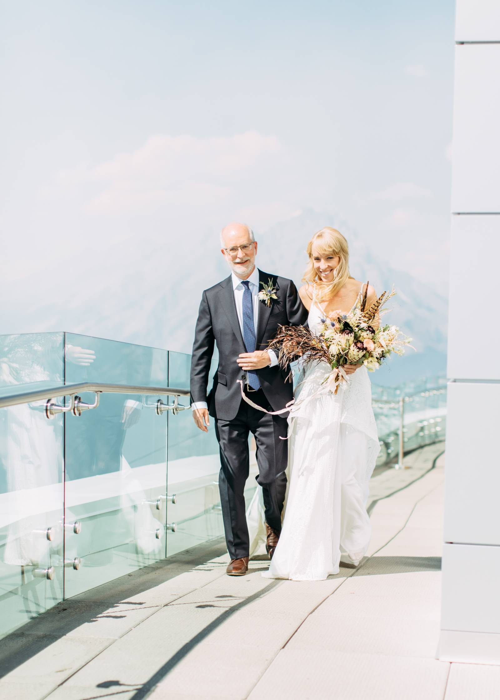 father walking bride down the aisle at mountain top ceremony