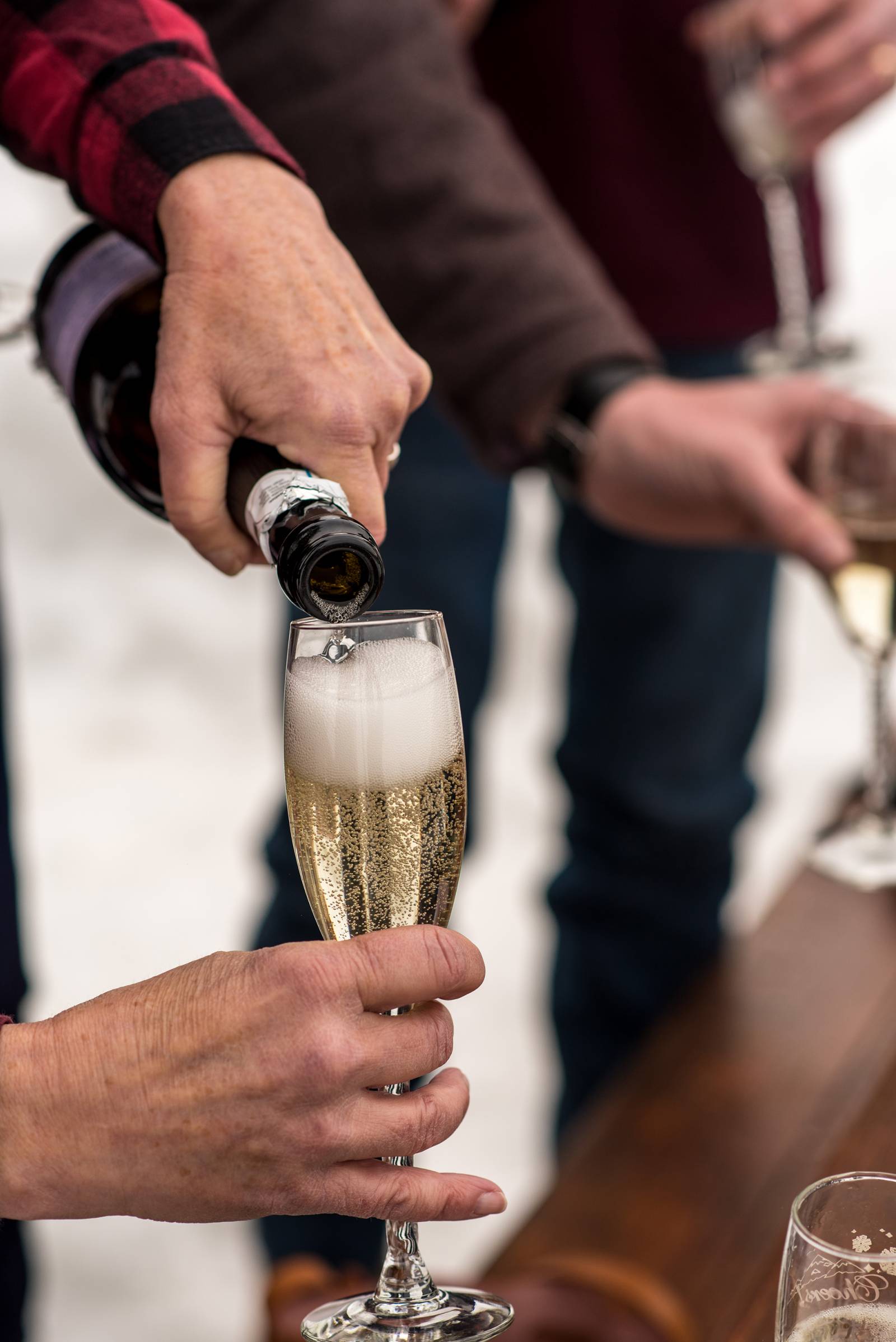 pouring celebration champagne | surprise proposal | Devil's Thumb Ranch Resort and Spa | Colorado we