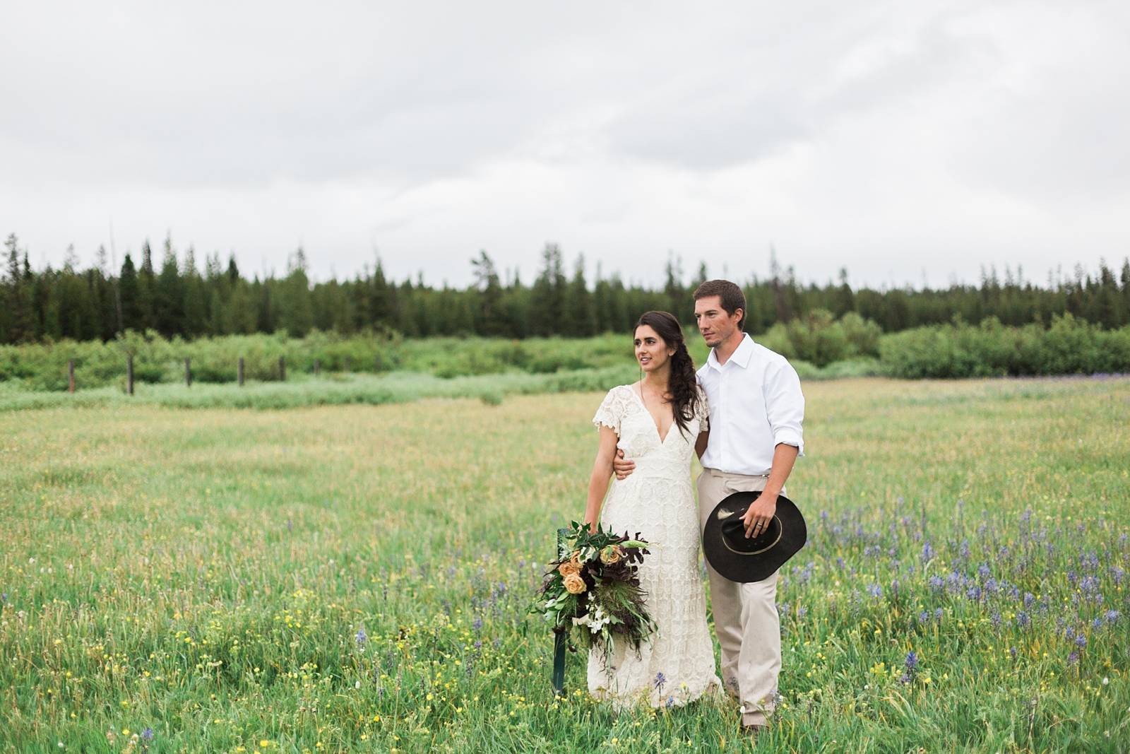 romantic bohemian portrait of bride and groom | Yellowstone Under Canvas | Montana wedding venue
