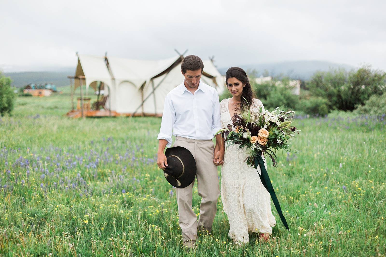 romantic bohemian portrait of bride and groom | Yellowstone Under Canvas | Montana wedding venue