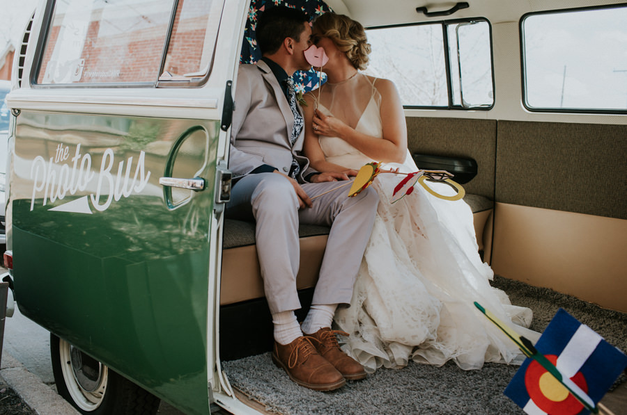 bride and groom kissing in wedding photo bus | wedding inspiration