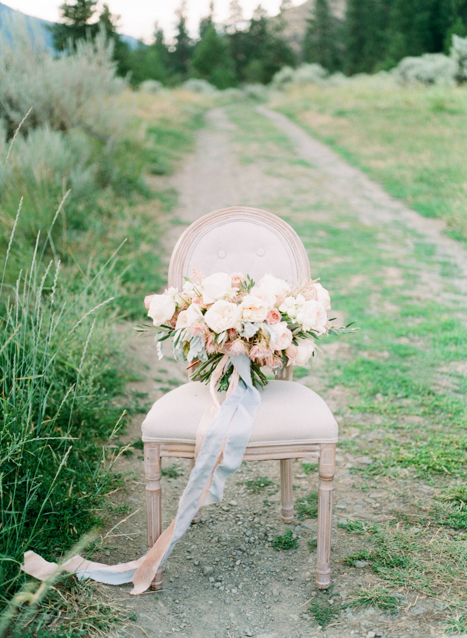 summer bridal inspiration | bride wearing wedding dress designed by Lillian Wild Bridal | bouquet in