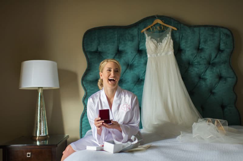 bride receiving gift from groom