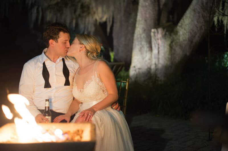 bride and groom at fire pit