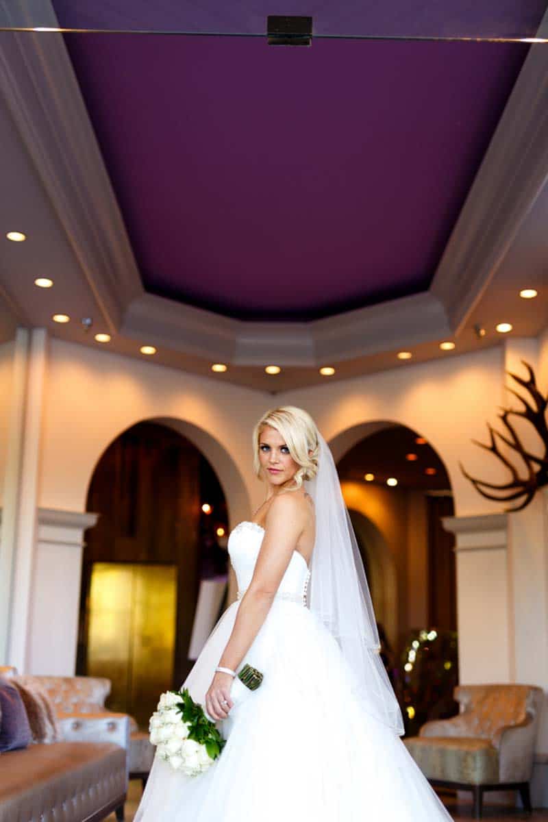 bride in ball gown holding white bouquet