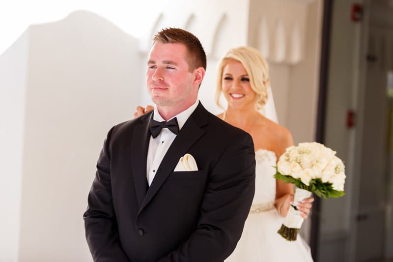 bride tapping groom on shoulder
