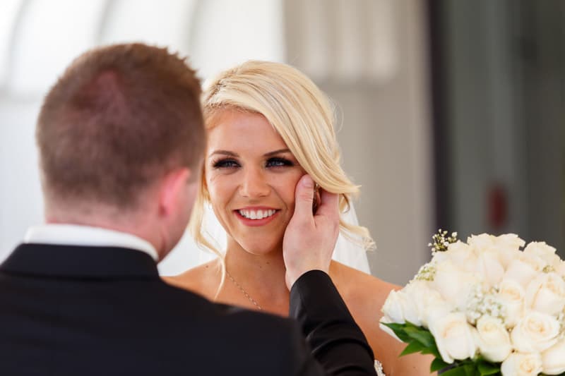 groom holding bride's cheek