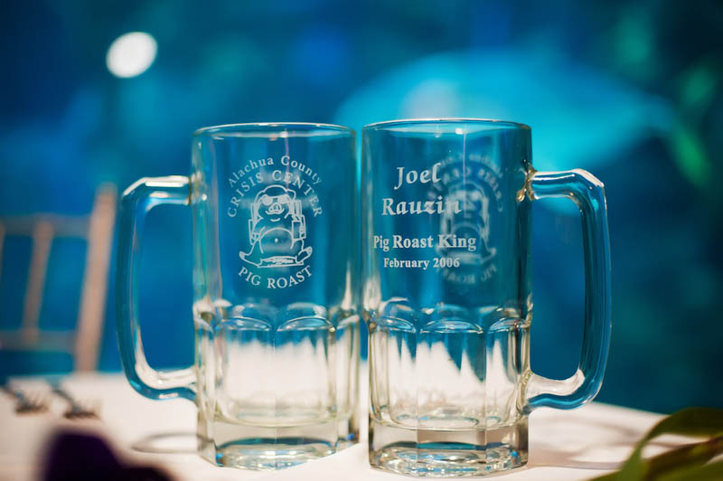 glass steins etched with pig roast competition logo