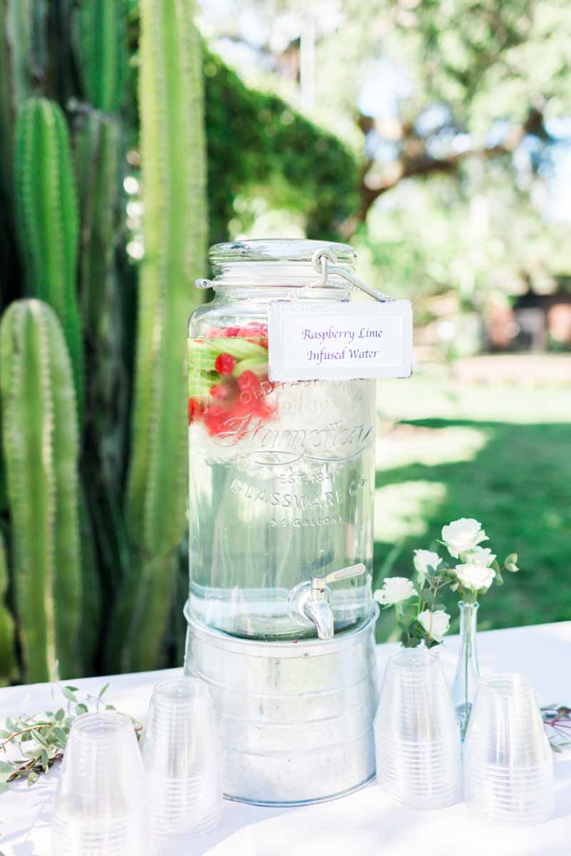 raspberry lime infused water dispenser on table