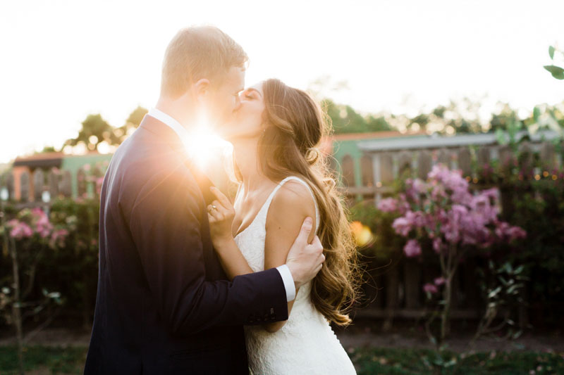 couple kissing in sunlight
