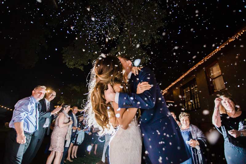 bride and groom kissing for grand exit