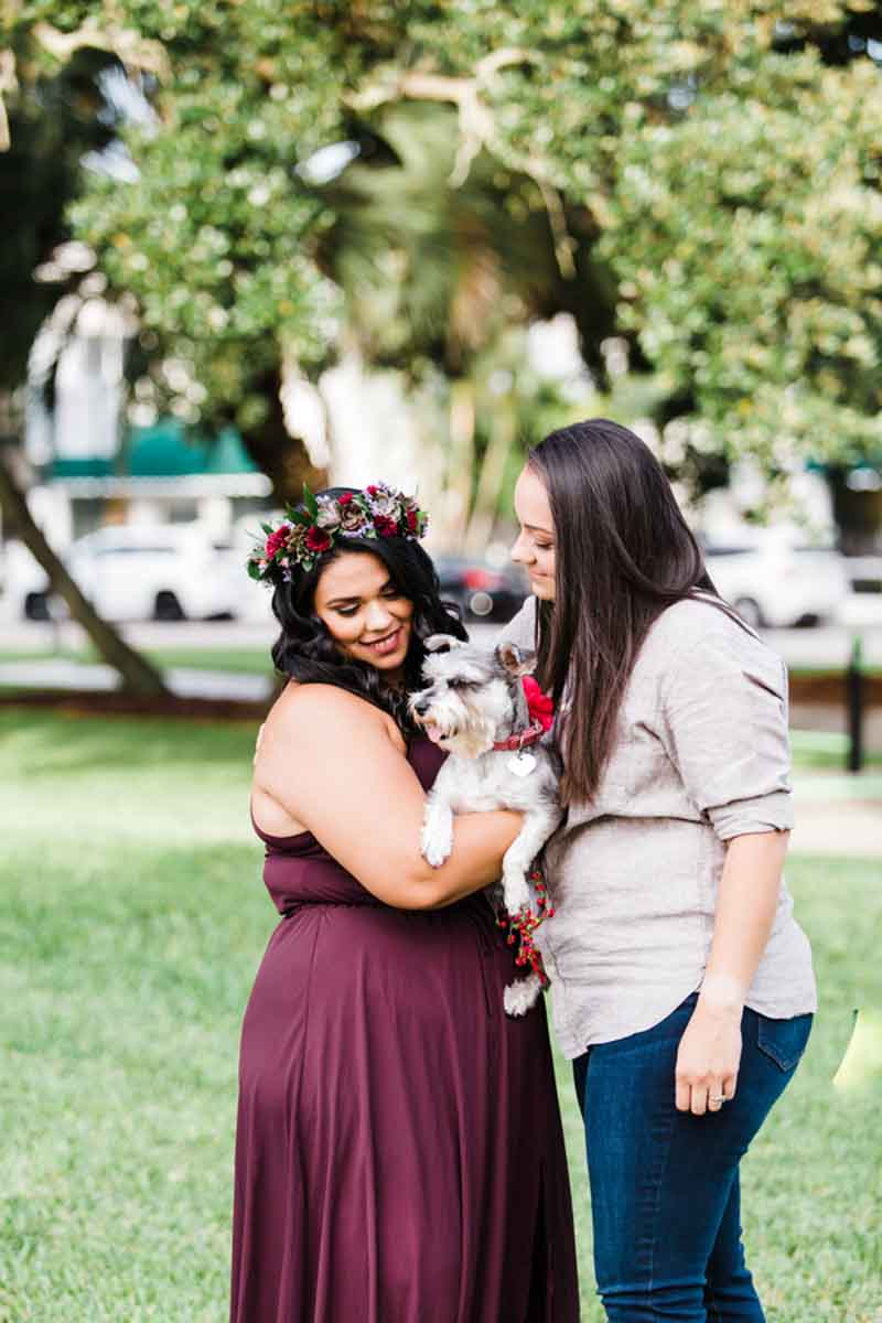 couple holding dog for sweet engagement session