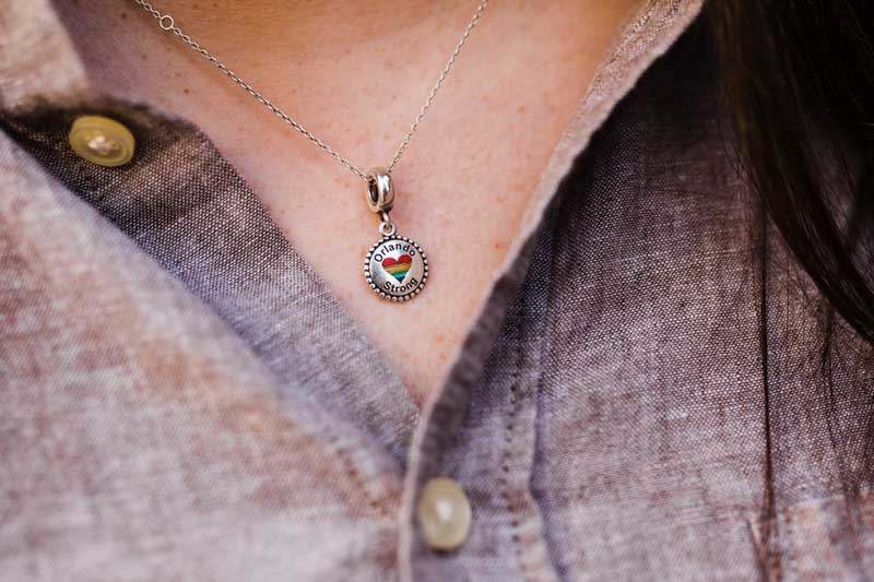 woman wearing an Orlando Strong necklace