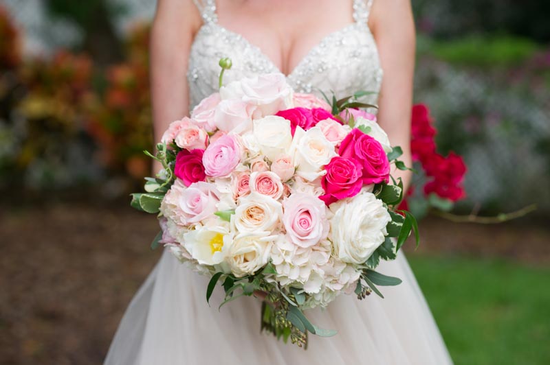 bride holding pink and white bouquet