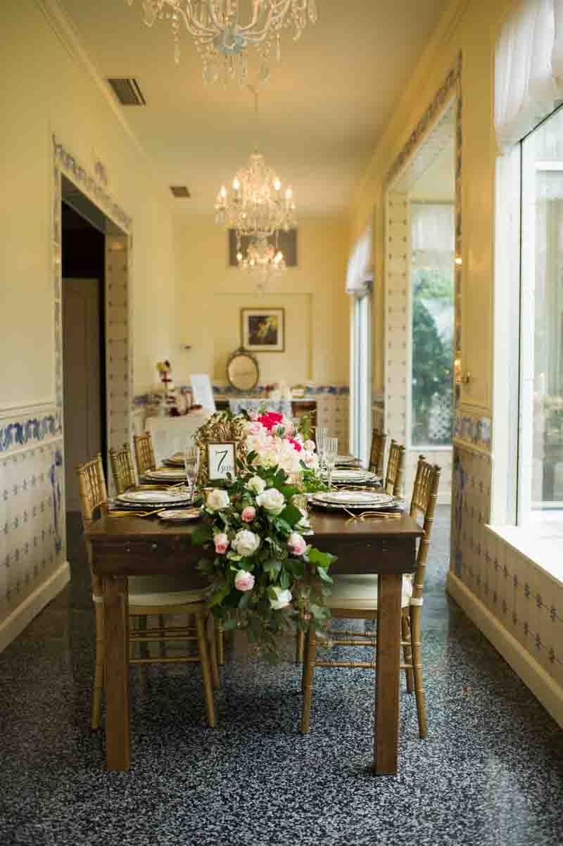 wedding reception table with floral garland