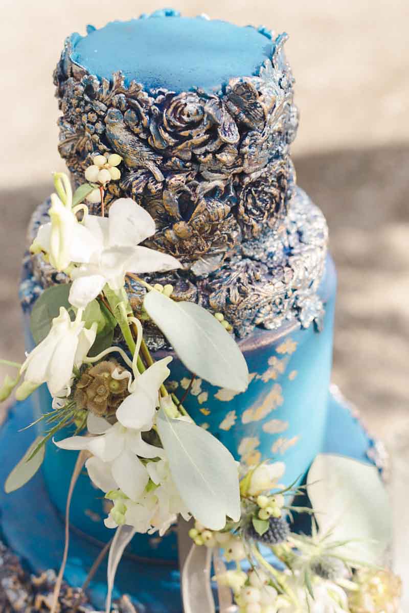 top tier of rose embossed blue wedding cake