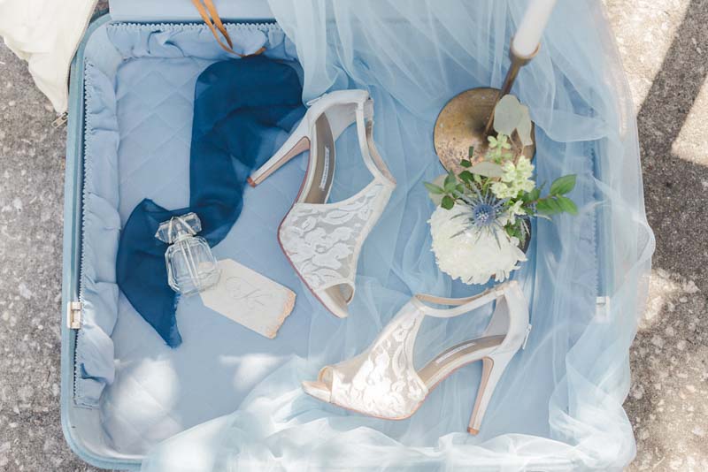 lace bridal shoes in blue suitcase