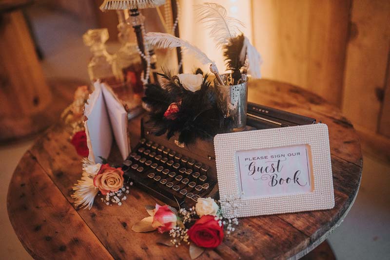 framed guestbook sign on wood stool