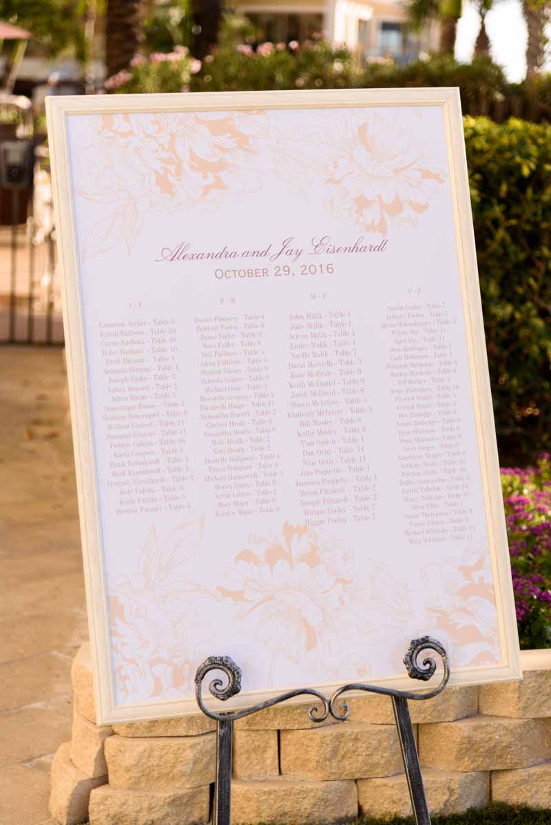 framed wedding guest seating chart on easel