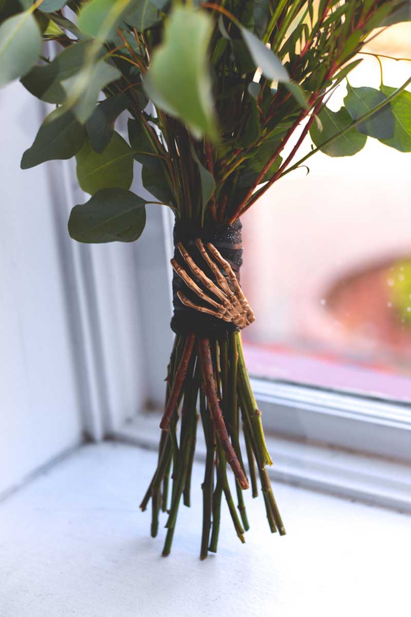 skeleton hand on bouquet stems