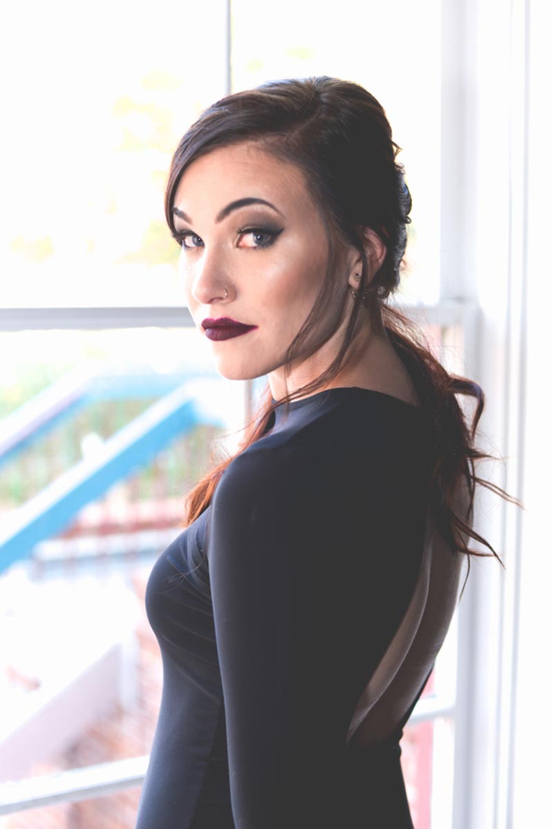 bride in black dress looking over shoulder