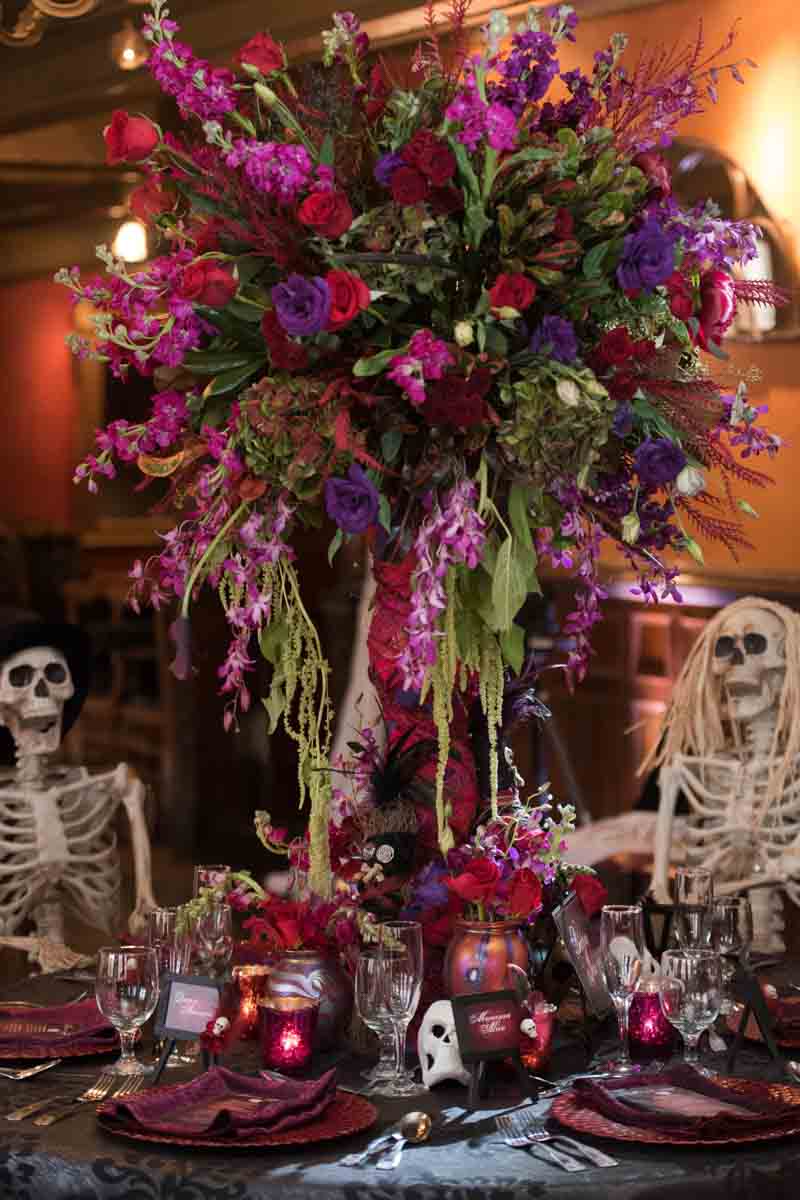 tall red and purple reception center piece