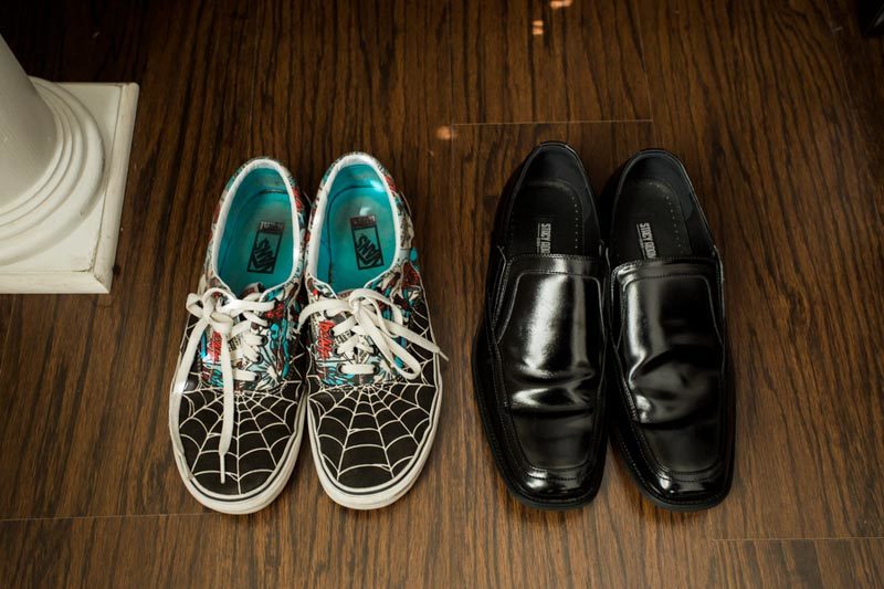 bride's spiderman tennis shoes and groom's shoes
