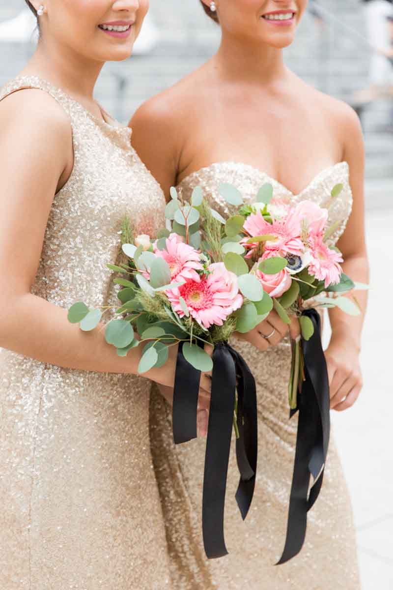 bridesmaids holding pink bouquet