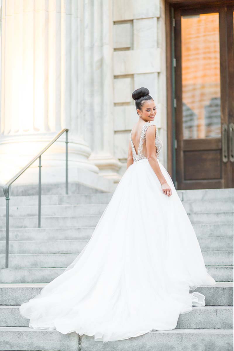 bride in ballgown on steps