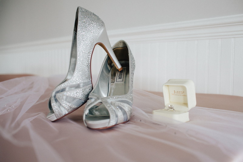 silver bridal shoes on counter
