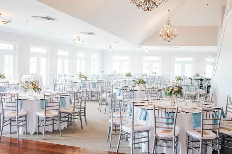reception space at the Tuscawilla Country Club with silver chairs